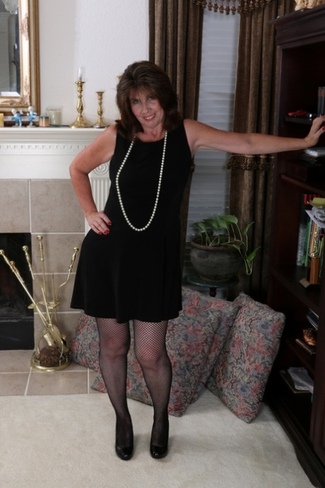 Slutty housewife gets naked and plays with a new sex toy