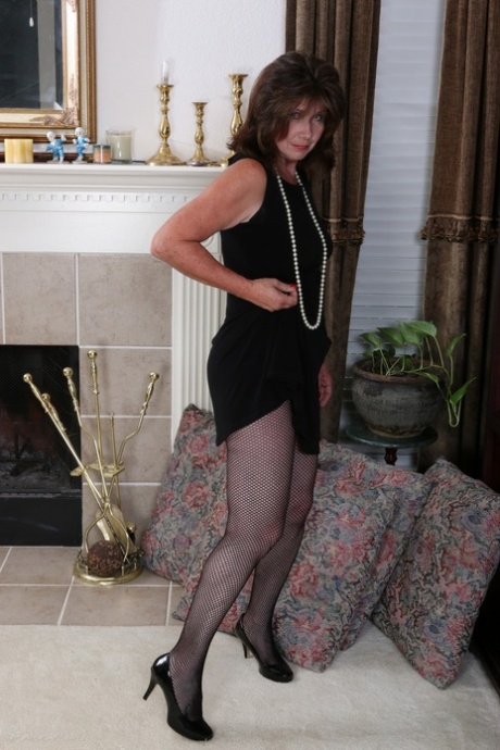 Slutty housewife gets naked and plays with a new sex toy