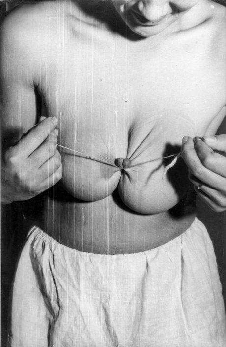 Busty model has her huge tits bound and milked in vintage BDSM session