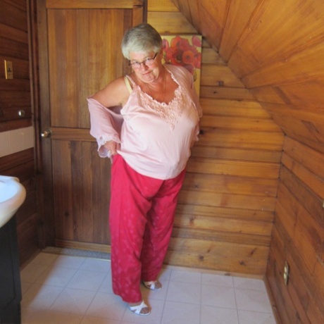 Naughty nan with short grey hair bares her big tits and butt with a striptease