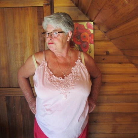 Naughty nan with short grey hair bares her big tits and butt with a striptease