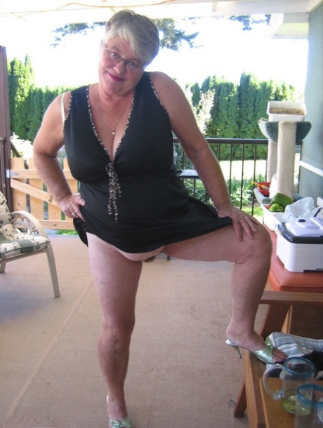 Old lady Girdle Goddess shakes her big butt while on a veranda