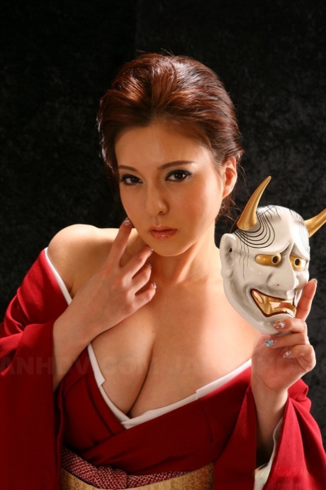 Japanese model Yuki Tsukamoto fondles her firm boobs as she gets naked