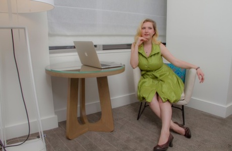 Blonde amateur Mim Turner releases her big natural tits as she removes dress