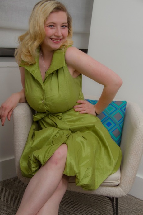 Blonde amateur Mim Turner releases her big natural tits as she removes dress