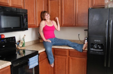 First timer Misty Summer gets naked in her kitchen albeit in a teasing manner