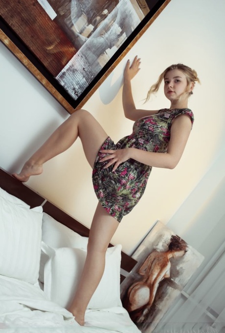 Gorgeous blonde teen Daniel Sea does an ass grab after baring her big boobs