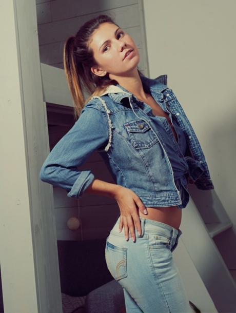 Beautiful girl Dare Taylor poses in the nude after removing denim clothing