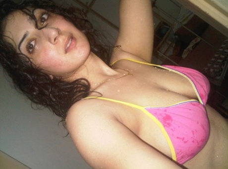 Indian solo girl takes self shots of her big natural tits