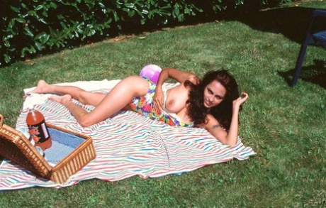 Indian MILF frees her nice boobs from swimwear in a backyard