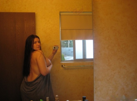 Thick amateur takes nude selfies after showering in a safe for work manner