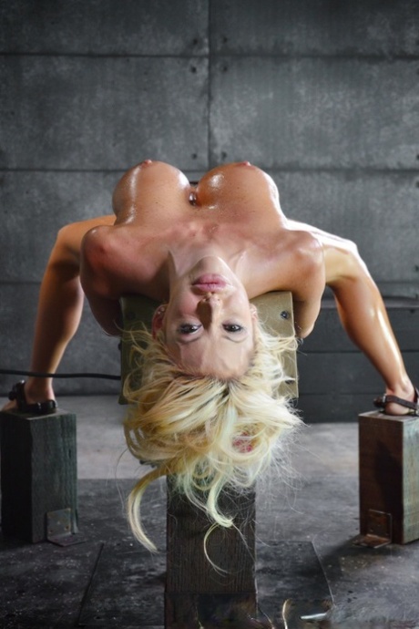 Big titted blonde Courtney Taylor endures hardcore fucking in a dungeon