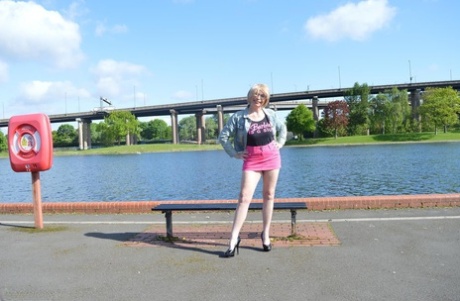 Leggy mature woman Barby Slut exposes her boobs while out in public places