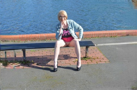 Leggy mature woman Barby Slut exposes her boobs while out in public places