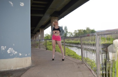 Leggy mature woman Barby Slut exposes her boobs while out in public places