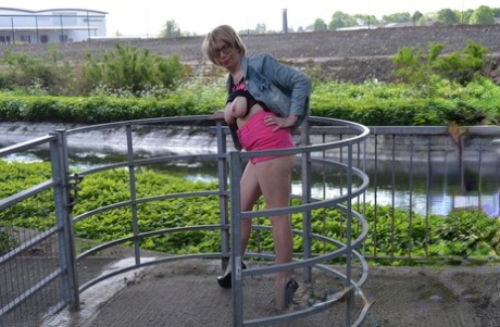 Leggy mature woman Barby Slut exposes her boobs while out in public places