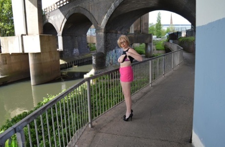 Leggy mature woman Barby Slut exposes her boobs while out in public places