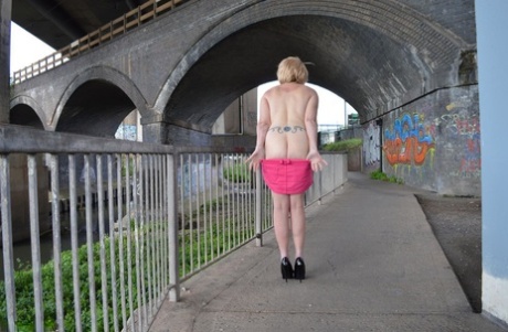 Leggy mature woman Barby Slut exposes her boobs while out in public places