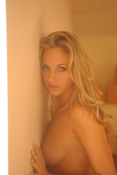 Gorgeous blonde Natasha gets naked in high-end cowgirl boots