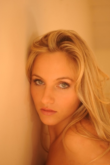 Gorgeous blonde Natasha gets naked in high-end cowgirl boots