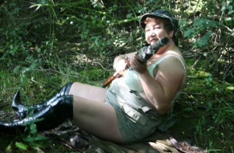 Fat amateur Kinky Carol gets naked in OTK boots at a hunting camp