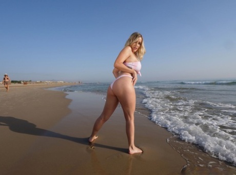 Tattooed blonde Marica Chanel unleashes her great tits while at the beach