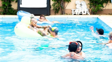 Group sex enthusiasts raise a toast after poolside fucking and car washing