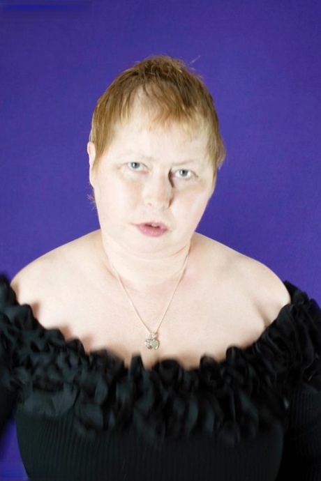 Fat older woman Posh Sophia fondles her huge boobs after getting bare naked