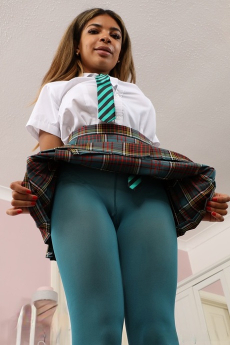 College girl Jay lets her big boobs free while wearing pantyhose and heels