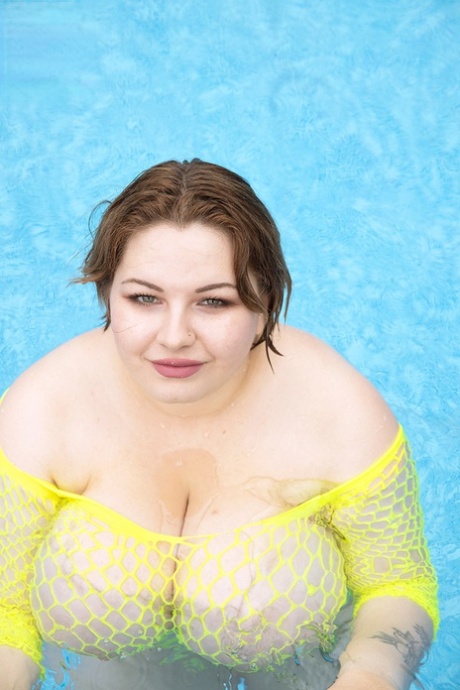 Fat lesbians Mary Brown & Molly Evans play with each others giant boobs