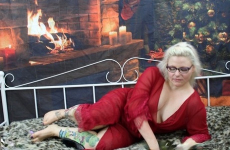Tattooed UK blonde Mollie Foxxx looses her tits and ass from a red robe