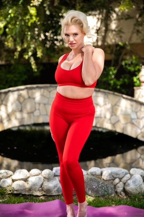 Blonde cougar Charli Phoenix gives a blowjob in a backyard environment