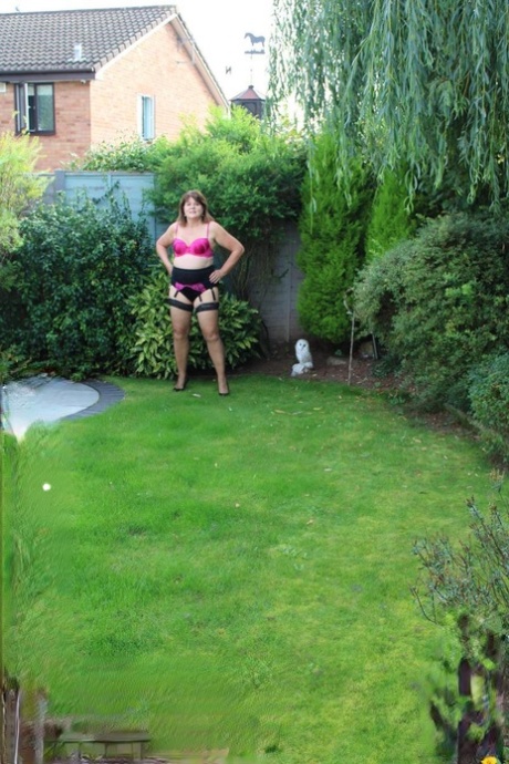 Mature woman Cassandra Uk slides her underwear aside to get at her horny pussy