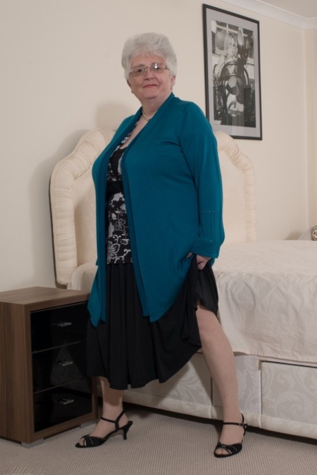 Overweight British grandmother covers her naked boobs with her hands