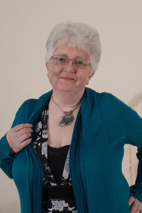 Overweight British grandmother covers her naked boobs with her hands