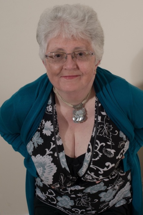 Overweight British grandmother covers her naked boobs with her hands