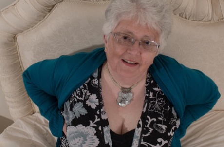 Overweight British grandmother covers her naked boobs with her hands