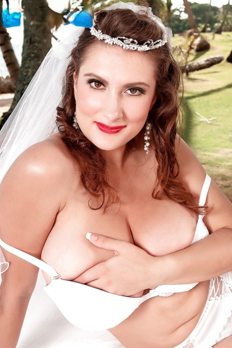 Stocking and garter clad pornstar Valory Irene baring big tits at wedding