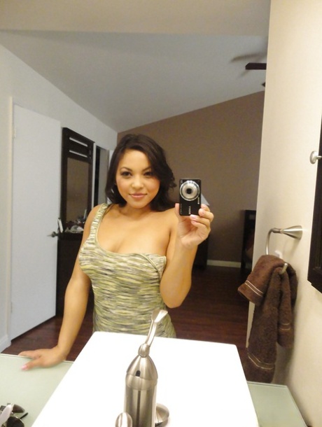 Brunette chick Adriana Luna taking nude selfies in mirror while undressing