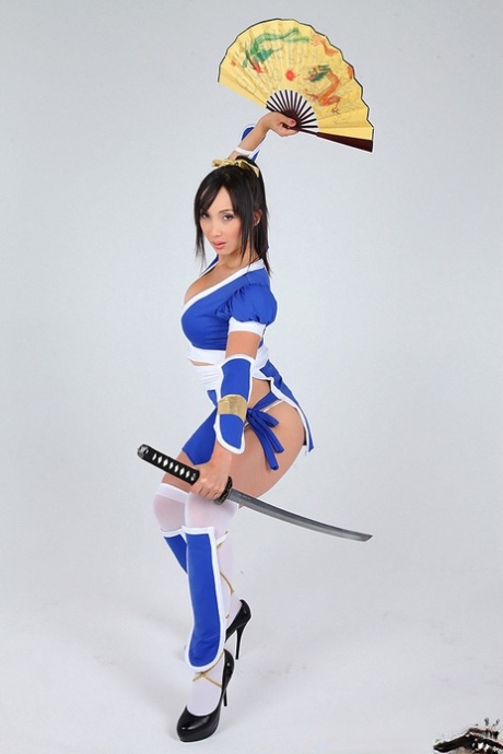 Asian solo model releases her big tits from her cosplay costume