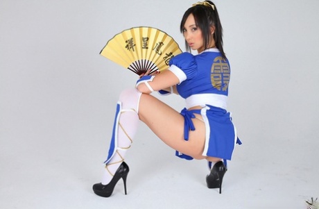 Asian solo model releases her big tits from her cosplay costume