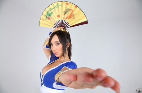 Asian solo model releases her big tits from her cosplay costume