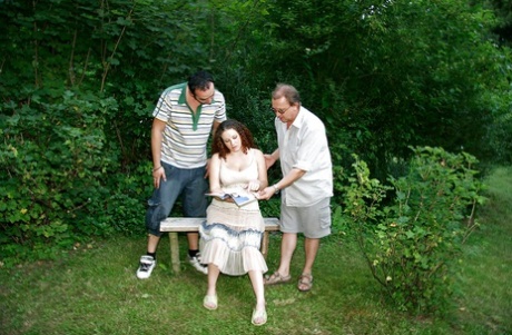 Curly-haired pregnant slut gets banged by four horny lads outdoor