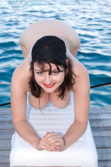 Mature woman Lorna Morgan reveals her huge knockers & hairy cunt on the dock