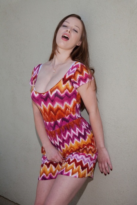 Teen girlfriend Natalie Moore flashes her undies and teases with her cleavage