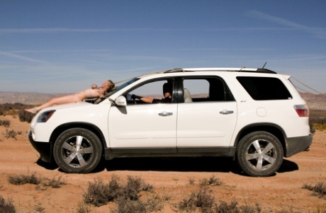 Naked Cherry Torn gets bound to a car & pulled by her big tits in the desert