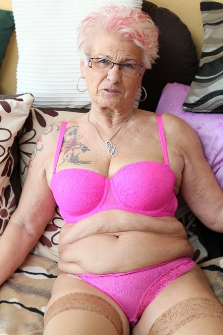 German granny Gerdi strips & spreads her sweet shaved old pussy on a bed