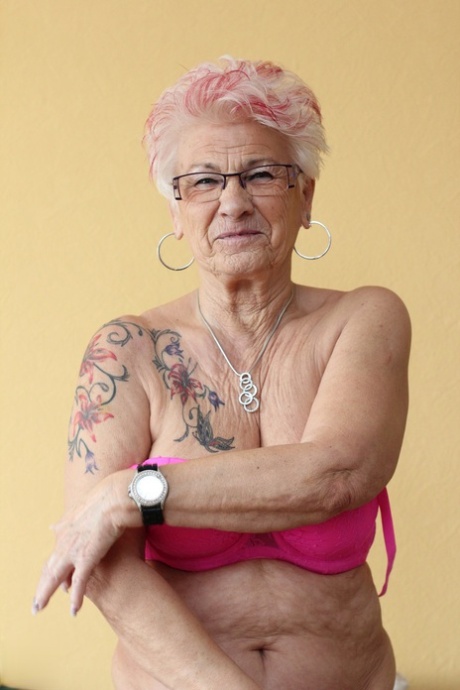 German granny Gerdi strips & spreads her sweet shaved old pussy on a bed