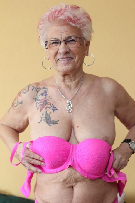 German granny Gerdi strips & spreads her sweet shaved old pussy on a bed