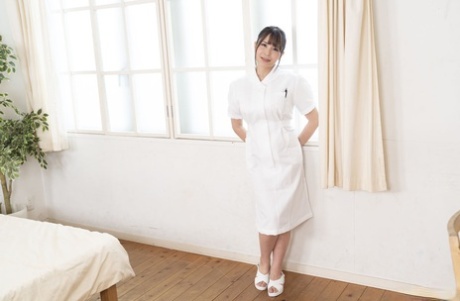 Hot Japanese masseuse Airi Mikumo grabs her big juggs while riding a dick
